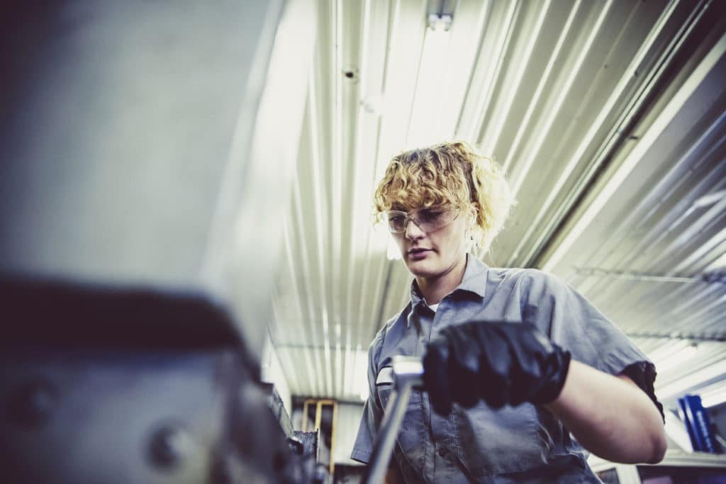 female-mechanic-working-on-a-heavy-machinery